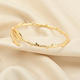 Gemini said Artemis Woodland Leaf Bypass Cuff
