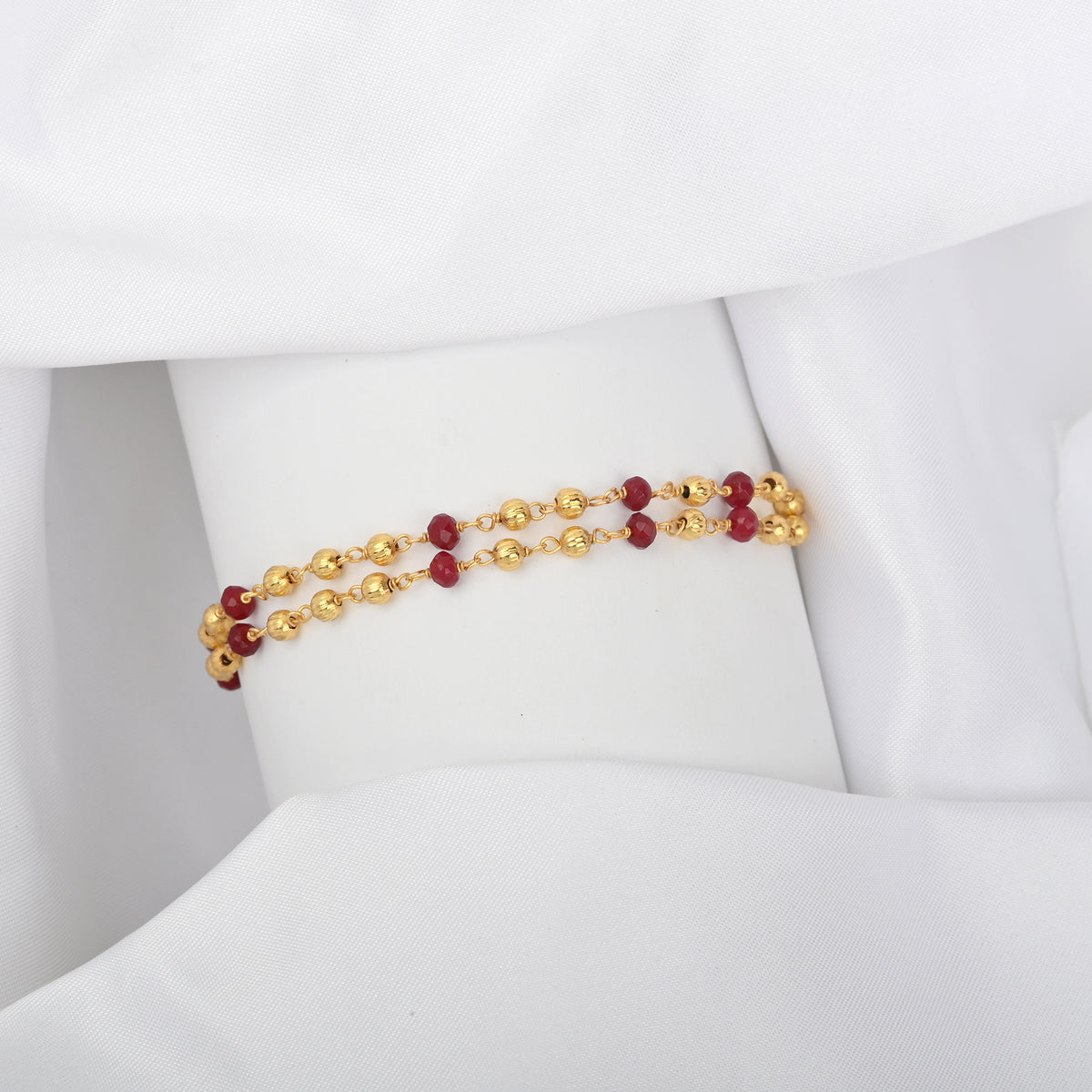 Two-Row Gold-Plated Bracelet with Faceted Ruby Beads