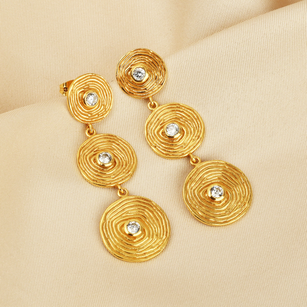 Triple Tier Gold Swirl Drop Earrings with Crystal Accents