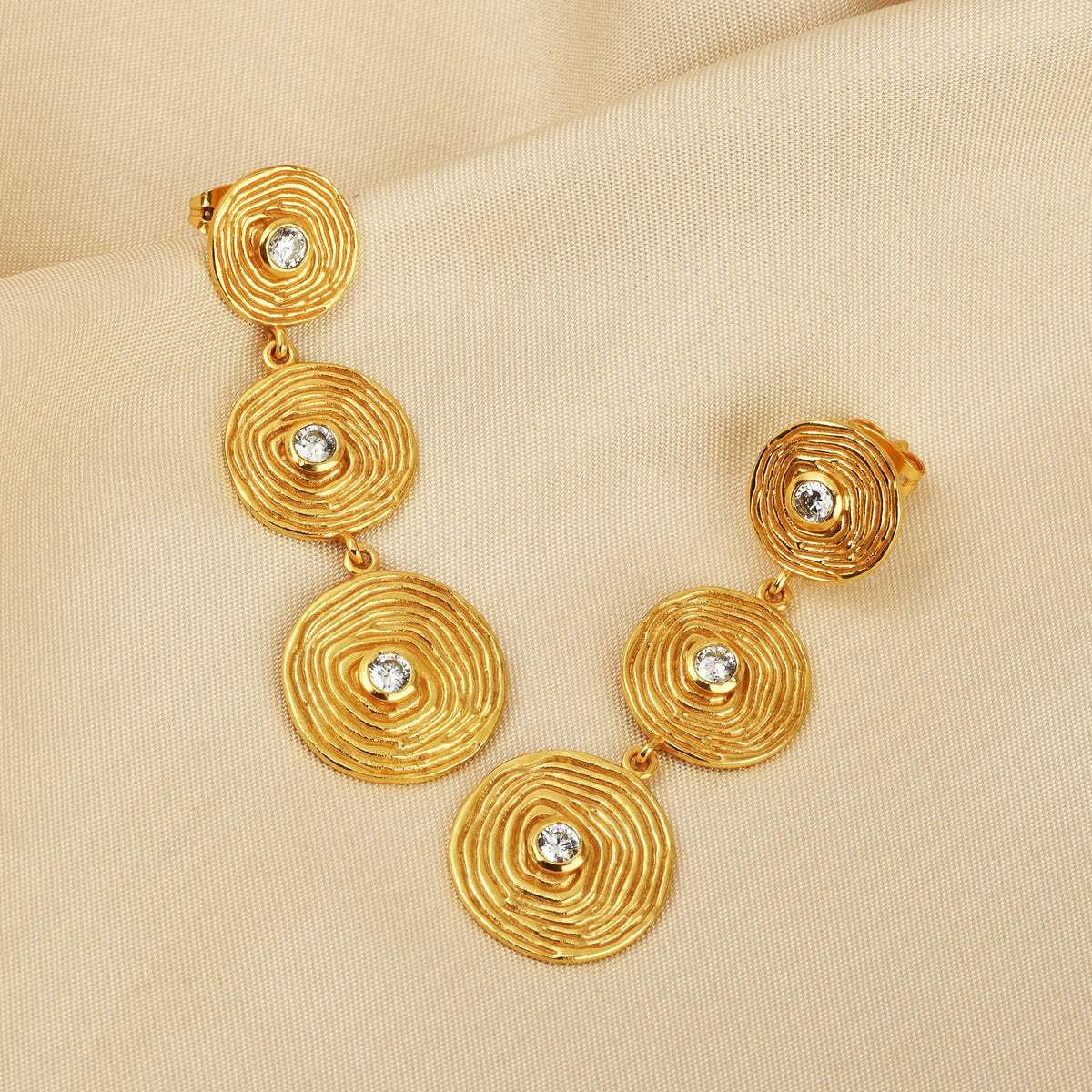 Triple Tier Gold Swirl Drop Earrings with Crystal Accents
