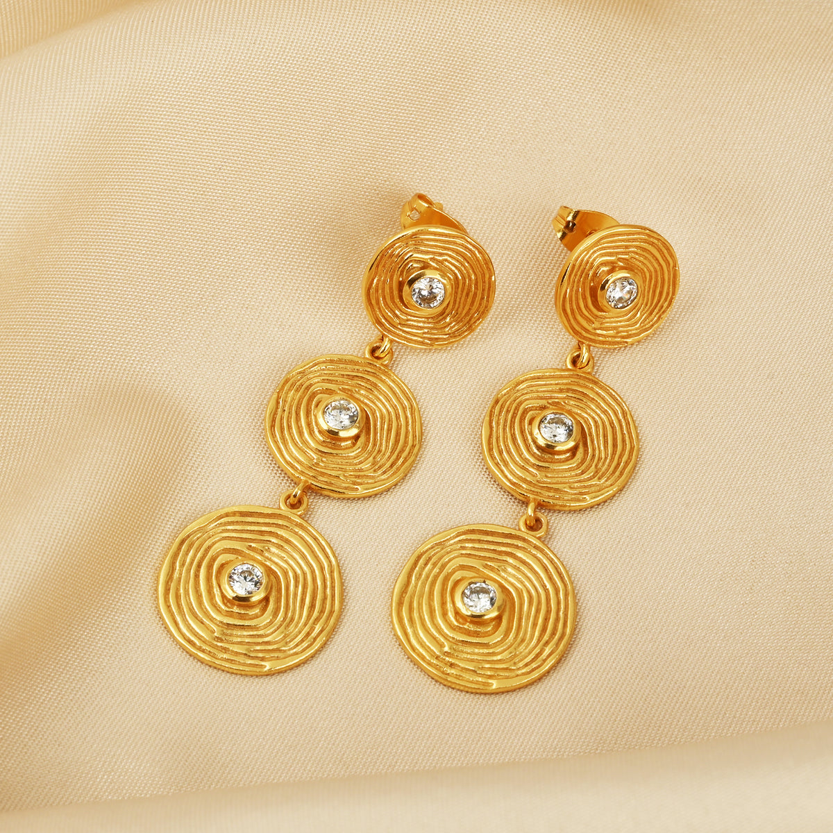 Triple Tier Gold Swirl Drop Earrings with Crystal Accents