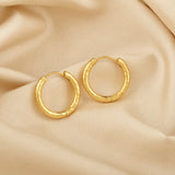 Circle shape Hammered Huggies Earrings