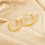 Circle shape Hammered Huggies Earrings